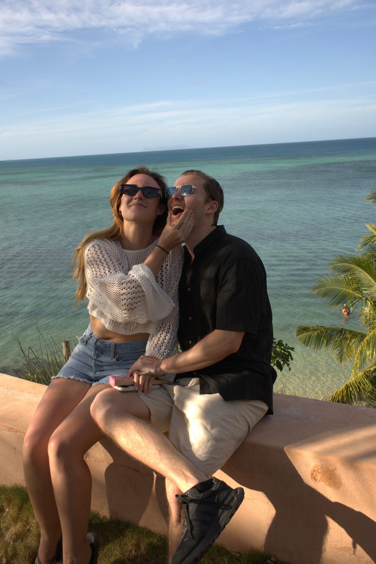 Daniel and Lauren sharing a quiet moment by the sea