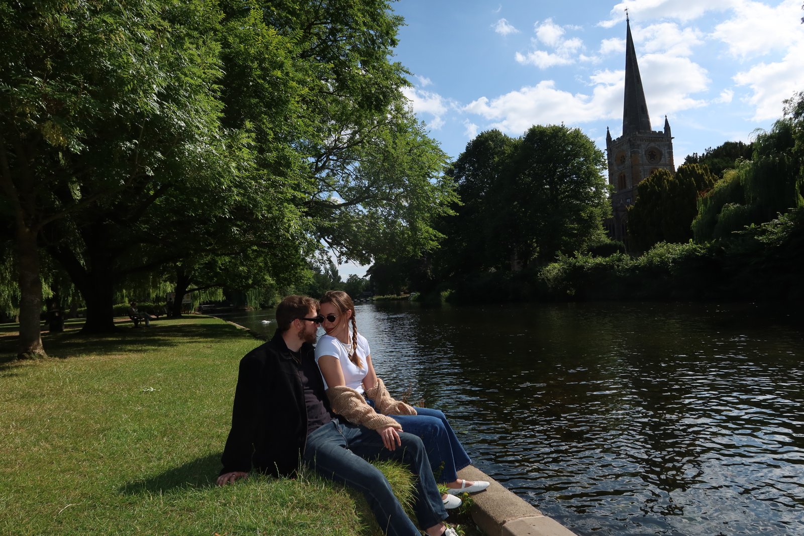 Daniel and Lauren sitting together beside the river